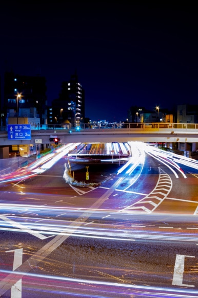 A night timelapse traffic jam at the crossing in Tokyo wide shot.